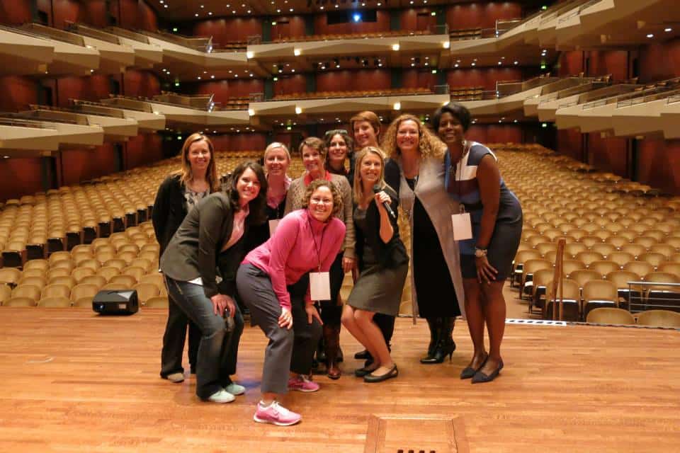 Karen in pink with speakers getting ready before the 2014 event at Benaroya Hall in Seattle.